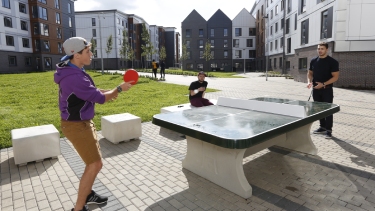 Three Hertfordshire International College Students playing table tennis on Campus at University of Hertfordshire