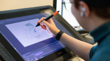 Student using computer software to create a digital animation