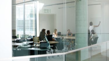 Classroom of people studying business