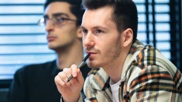 Two male Hertfordshire International College students in their Accounting and Finance lecture