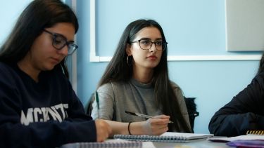 Two women sat in a classroom at the University of Hertfordshire