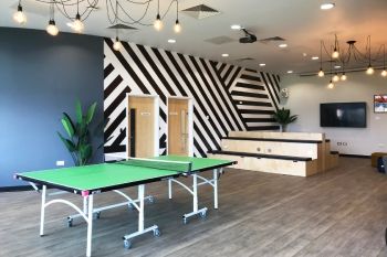Social space on campus at the University of Hertfordshire with table tennis table, and communal television