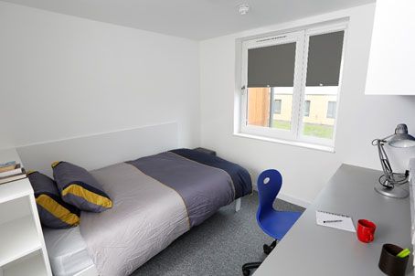 En-suite bedroom with study table and chair