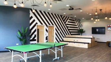 Social space on campus at the University of Hertfordshire with table tennis table, and communal television