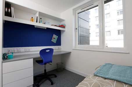 Standard en-suite bedroom with study table and chair