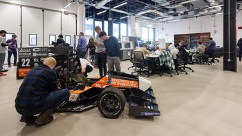 Automotive students assembling a Formula1 car inside the Spectra building